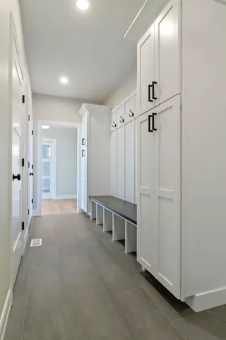 a view of a hallway with chandelier