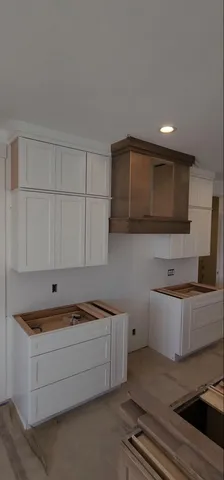 a kitchen with a sink and cabinets