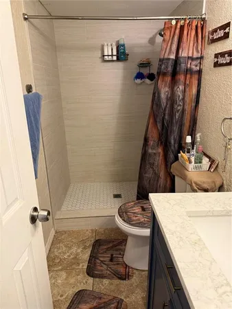 a bathroom with a sink and toilet