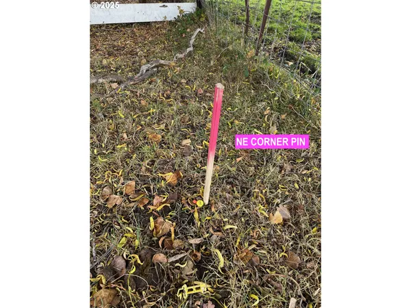 a street sign that is sitting on a brick wall