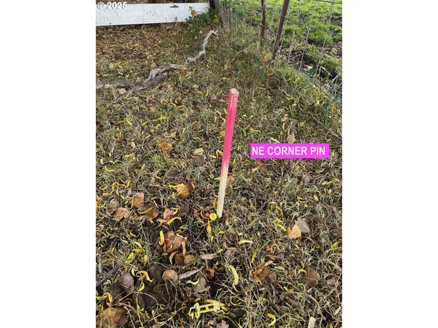 a street sign that is sitting on a brick wall