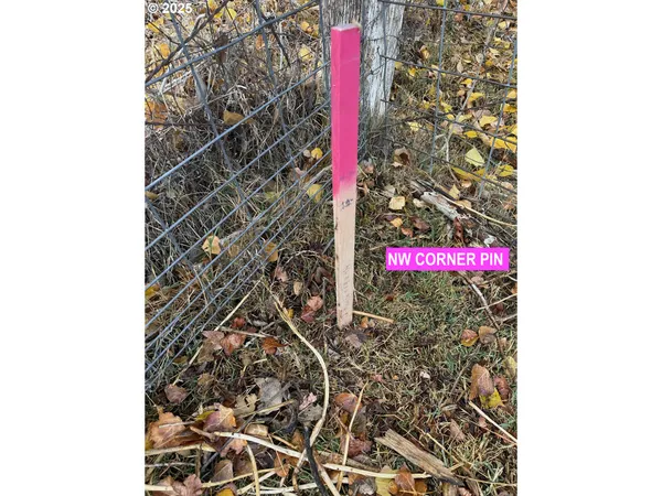 a street sign on a wall next to a building