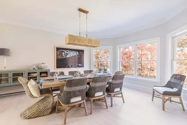 a view of a dining room with furniture window and outside view