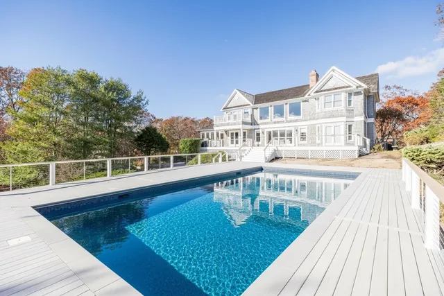 a view of a balcony with swimming pool