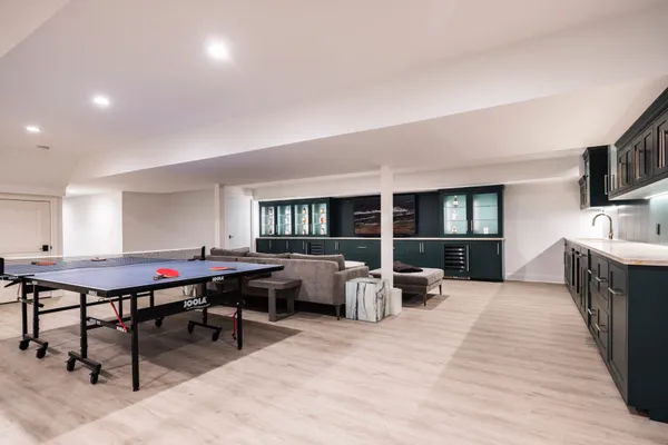 a living room with furniture a rug and a flat screen tv