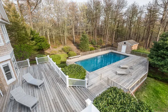 swimming pool view with a seating space
