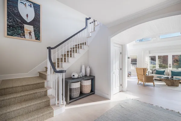 a view of entryway livingroom and hall with wooden floor