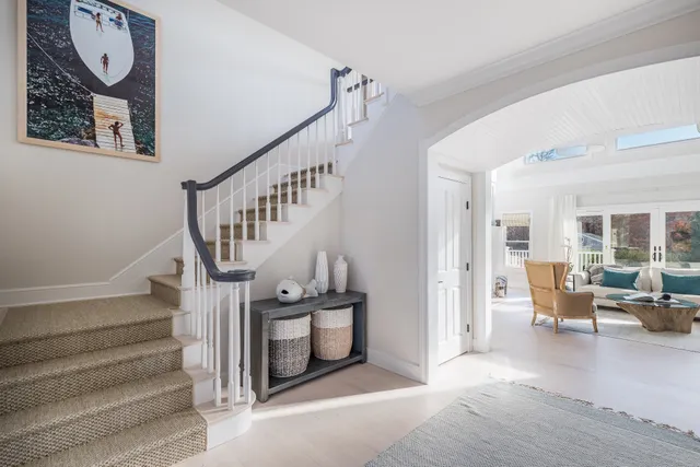 a view of entryway livingroom and hall with wooden floor