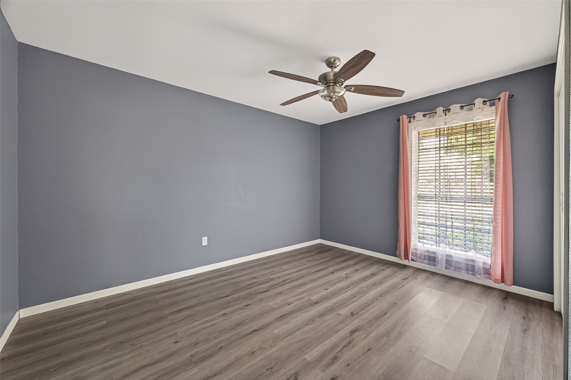 24006 Lone Elm Drive Spring, TX 77373 - Photo 11 of 25 Secondary bedroom 1 has a ceiling fan