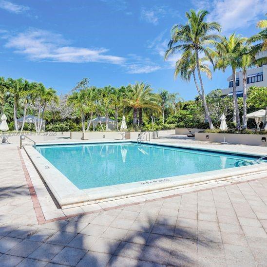 151 Crandon Boulevard, Unit 1130 Key Biscayne, FL 33149 - Photo 26 of 30 a view of swimming pool with a yard