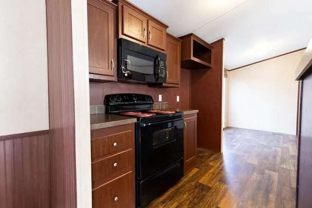 a kitchen with a sink and stove