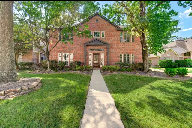 a front view of a house with yard