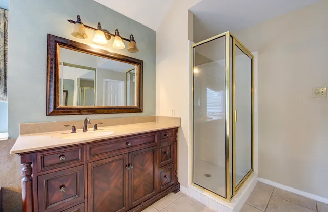 a bathroom with a sink and a mirror