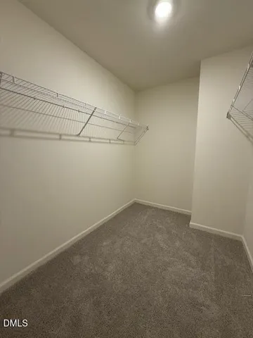 a bathroom with a granite countertop sink toilet and mirror