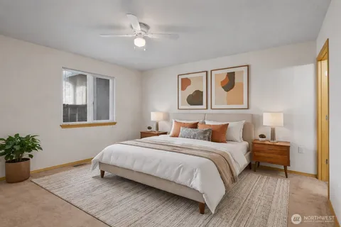 an empty room with fan and entrance