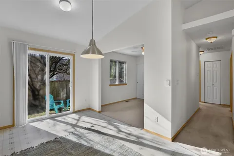 a view of a hallway with windows