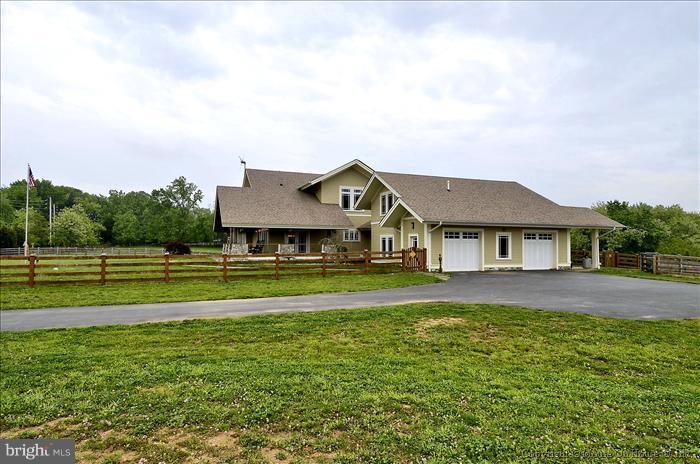 18340 Cattail Road Poolesville, MD 20837 - Photo 11 of 30 a view of a big house with a big yard and large trees