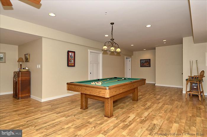 18340 Cattail Road Poolesville, MD 20837 - Photo 15 of 30 a room with pool table and wooden floor