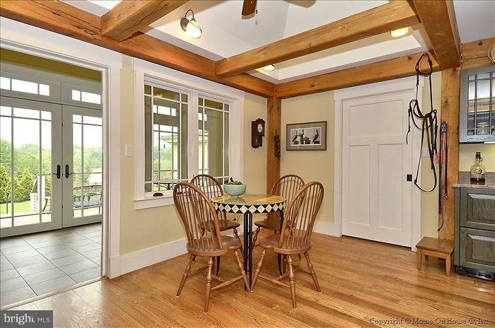 18340 Cattail Road Poolesville, MD 20837 - Photo 19 of 30 a view of a dining room with furniture window and wooden floor