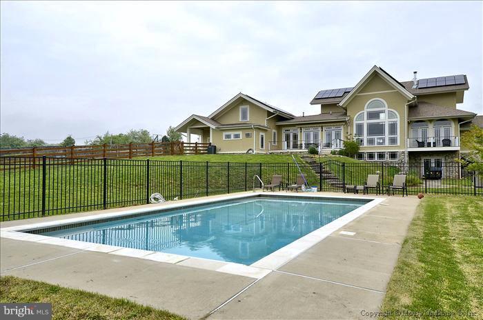 18340 Cattail Road Poolesville, MD 20837 - Photo 22 of 30 a view of a house with a swimming pool