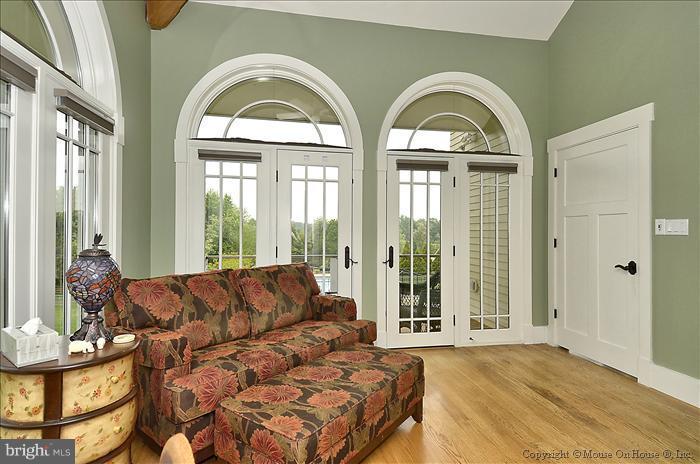 18340 Cattail Road Poolesville, MD 20837 - Photo 25 of 30 a living room with a large window