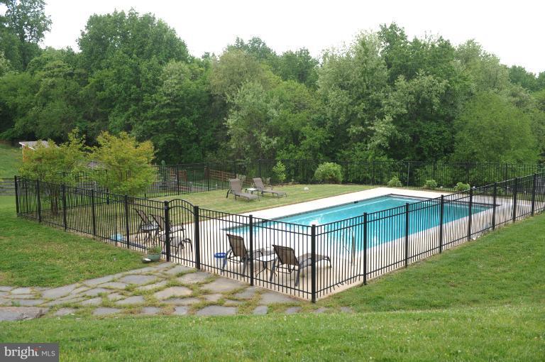 18340 Cattail Road Poolesville, MD 20837 - Photo 30 of 30 a view of backyard with two chairs and a table