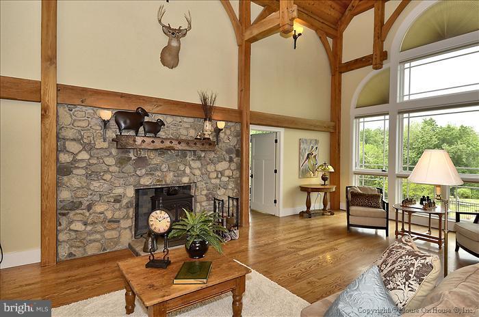 18340 Cattail Road Poolesville, MD 20837 - Photo 5 of 30 a living room with furniture and a fireplace