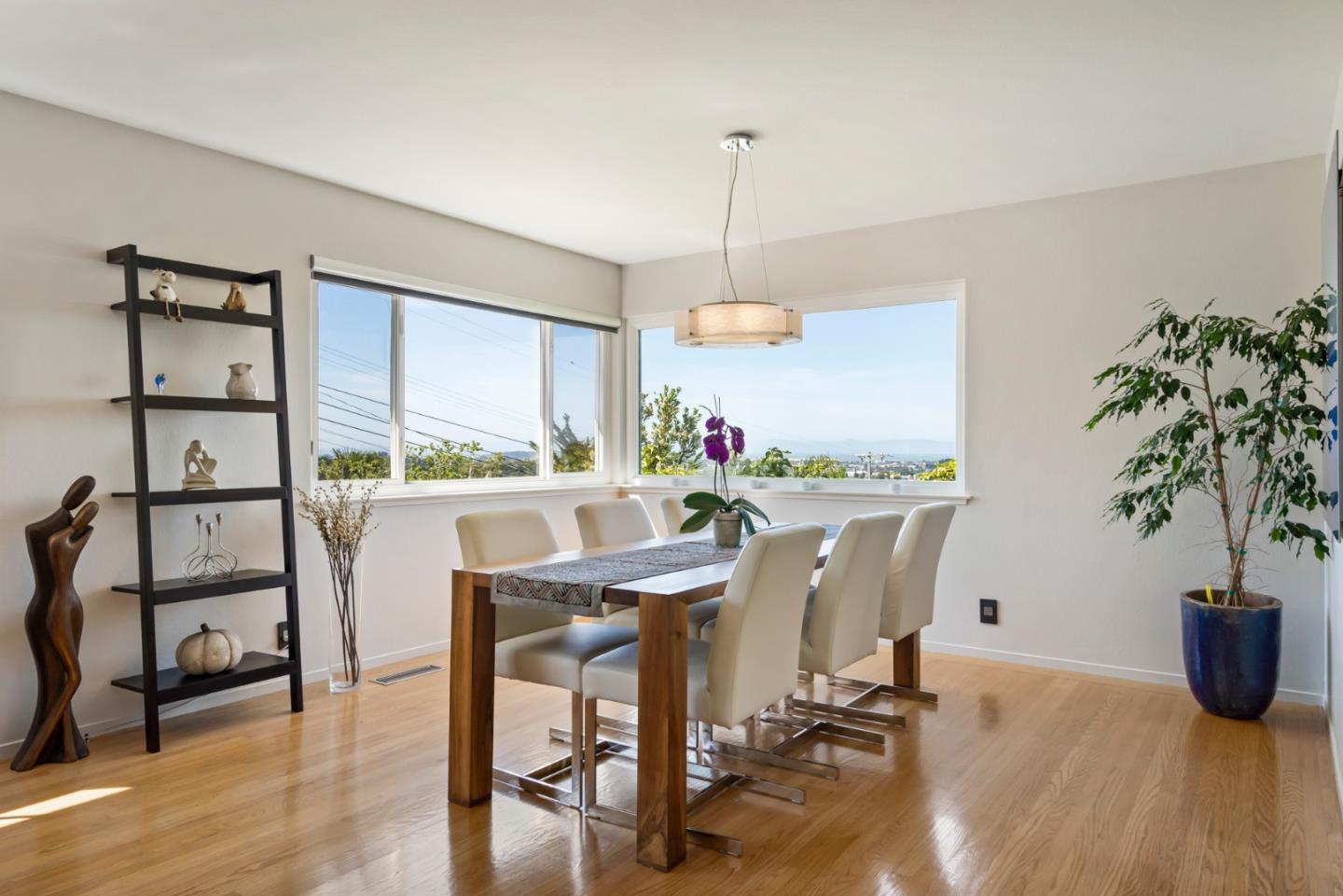 863 Viewridge Drive San Mateo, CA 94403 - Photo 13 of 50 a view of a dining room with furniture window and wooden floor