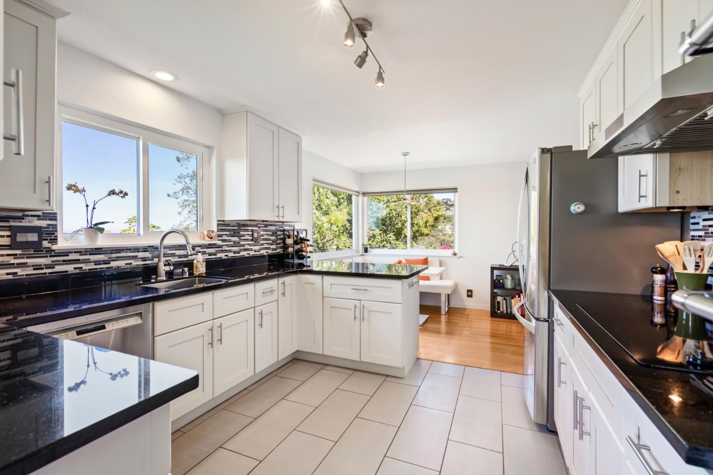 863 Viewridge Drive San Mateo, CA 94403 - Photo 14 of 50 a large kitchen with lots of counter space and windows