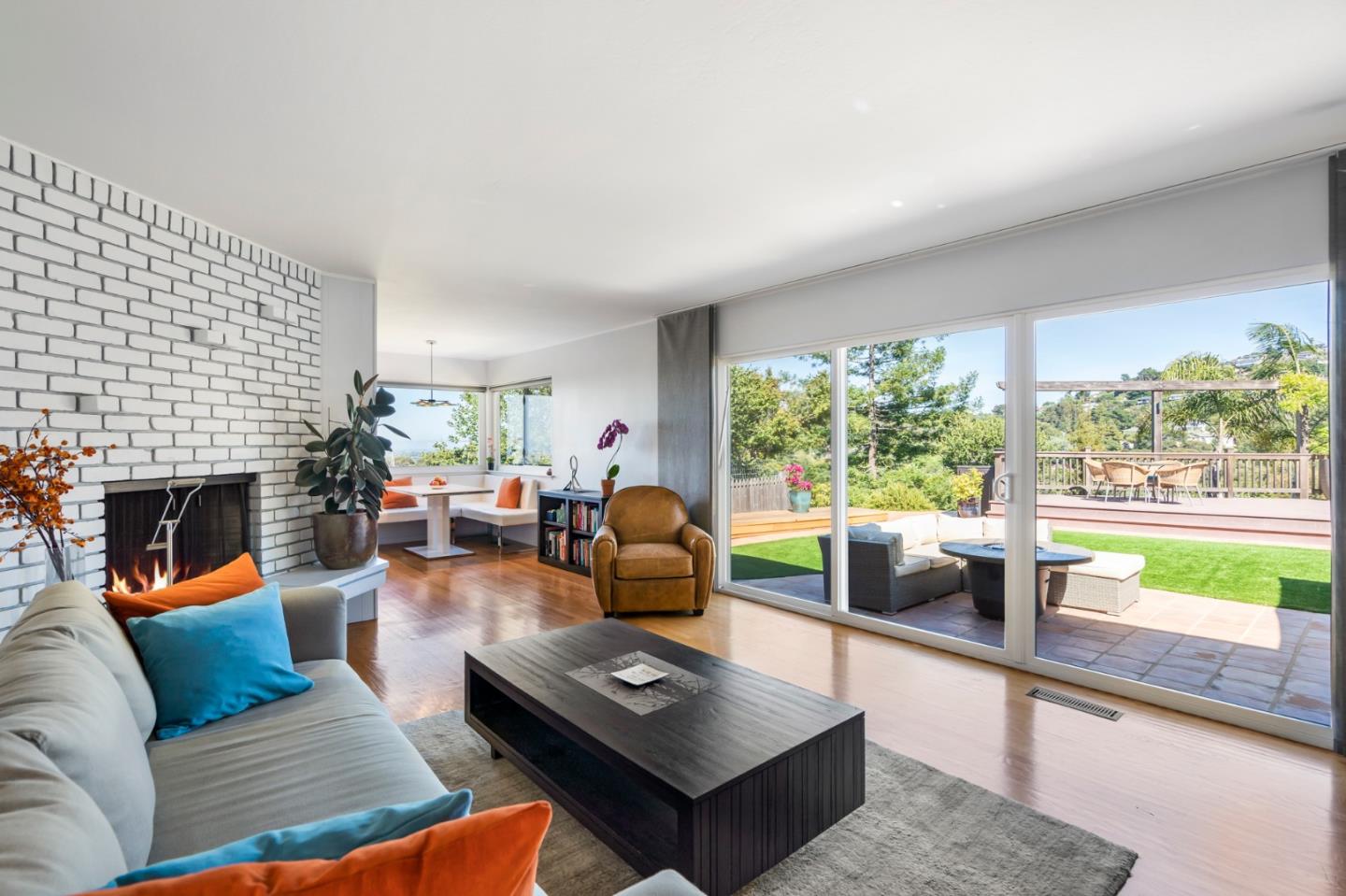 863 Viewridge Drive San Mateo, CA 94403 - Photo 23 of 50 a living room with furniture and a fireplace