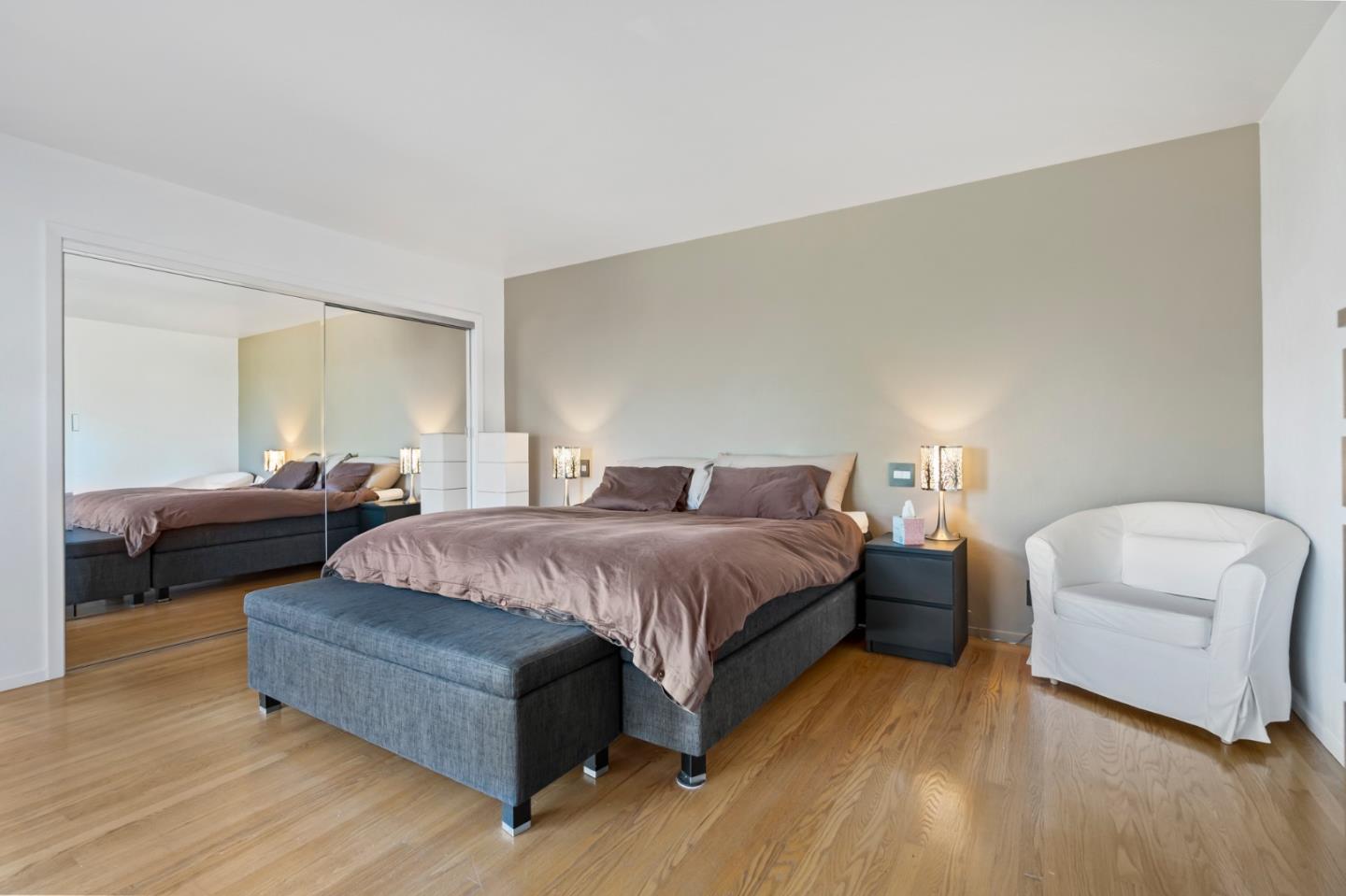 863 Viewridge Drive San Mateo, CA 94403 - Photo 33 of 50 a spacious bedroom with a bed and a couch