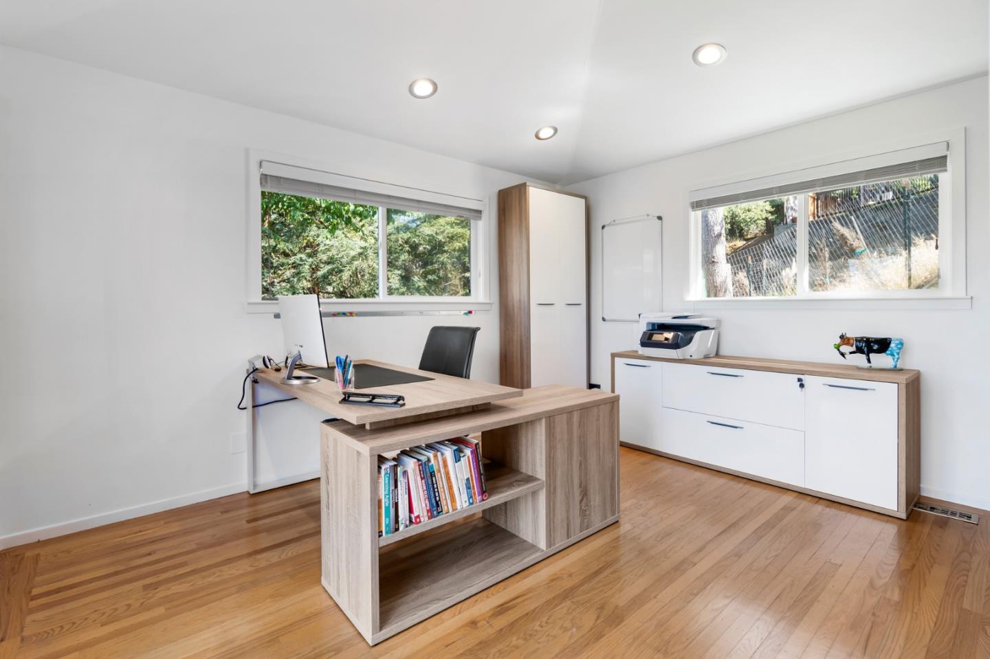 863 Viewridge Drive San Mateo, CA 94403 - Photo 34 of 50 a view of a workspace with furniture and a window