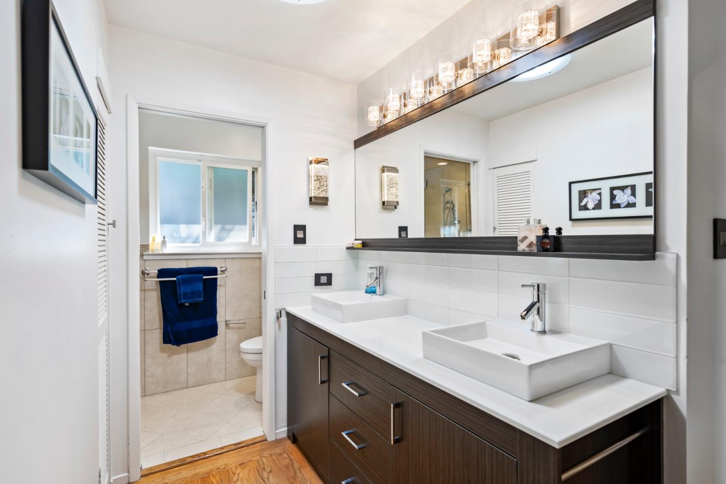 863 Viewridge Drive San Mateo, CA 94403 - Photo 36 of 50 a bathroom with a sink vanity and a mirror
