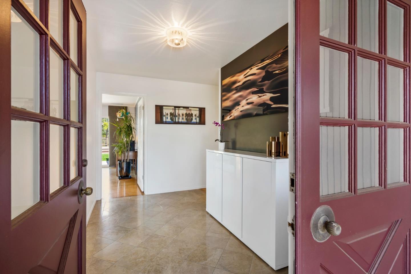 863 Viewridge Drive San Mateo, CA 94403 - Photo 4 of 50 a view of a livingroom with furniture and staircase