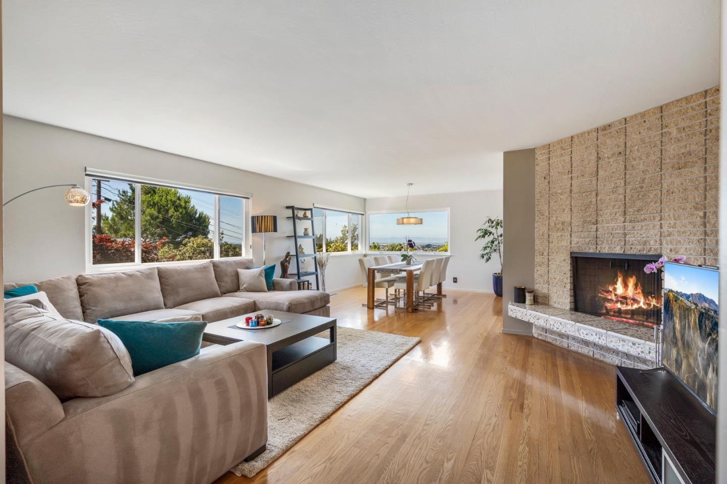 863 Viewridge Drive San Mateo, CA 94403 - Photo 6 of 50 a living room with furniture and a fireplace