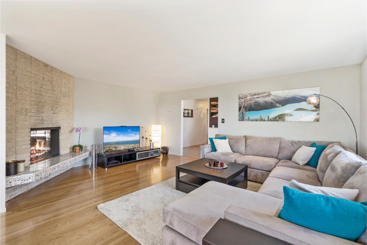 863 Viewridge Drive San Mateo, CA 94403 - Photo 7 of 50 a living room with furniture and a flat screen tv