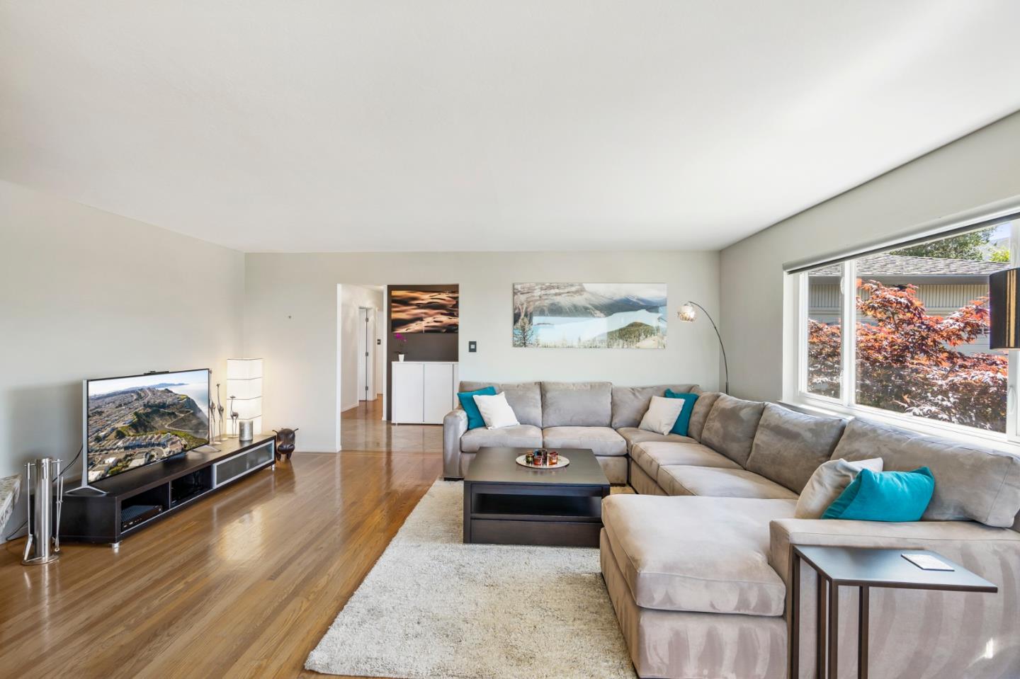 863 Viewridge Drive San Mateo, CA 94403 - Photo 8 of 50 a living room with furniture and a large window