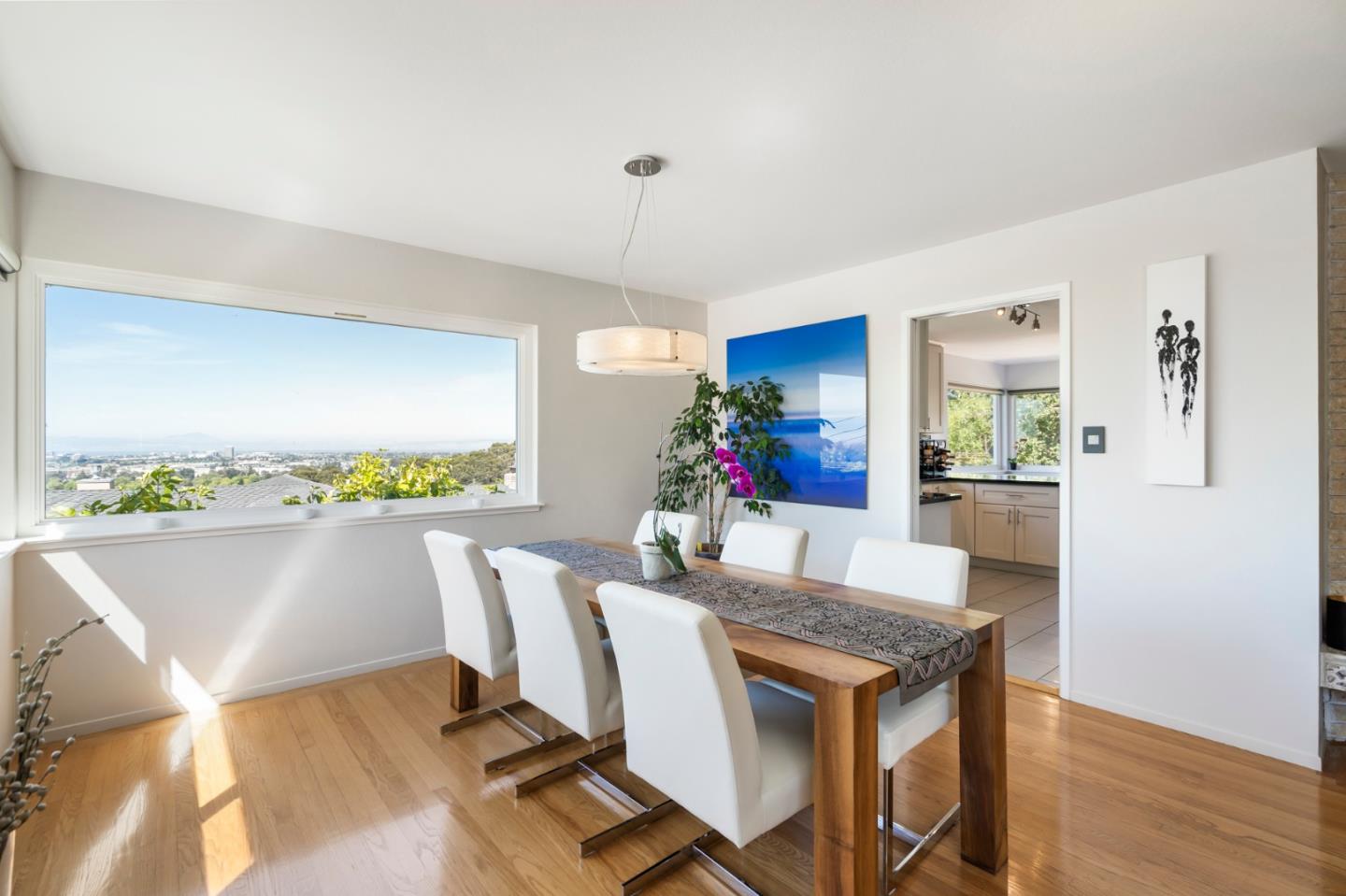863 Viewridge Drive San Mateo, CA 94403 - Photo 9 of 50 a view of a dining room with furniture window and wooden floor