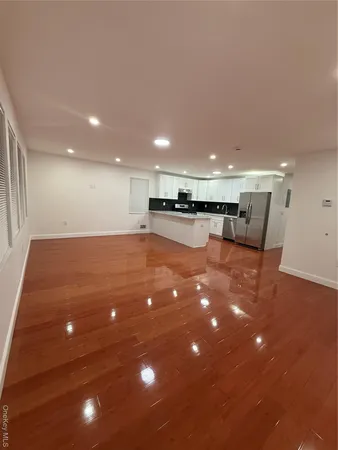 a kitchen with stainless steel appliances granite countertop a stove top oven a sink dishwasher and white cabinets
