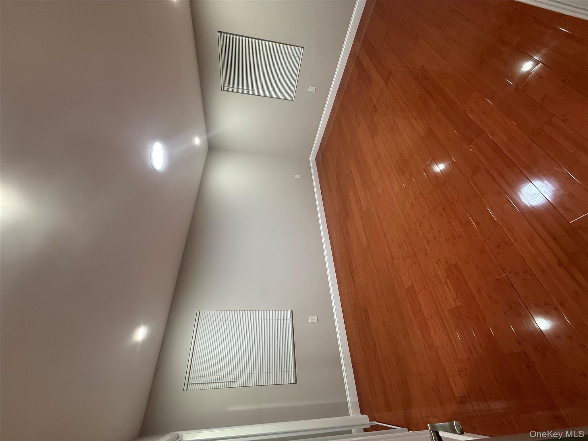 107-13 220th Street Queens, NY 11429 - Photo 4 of 10 an empty room with natural light