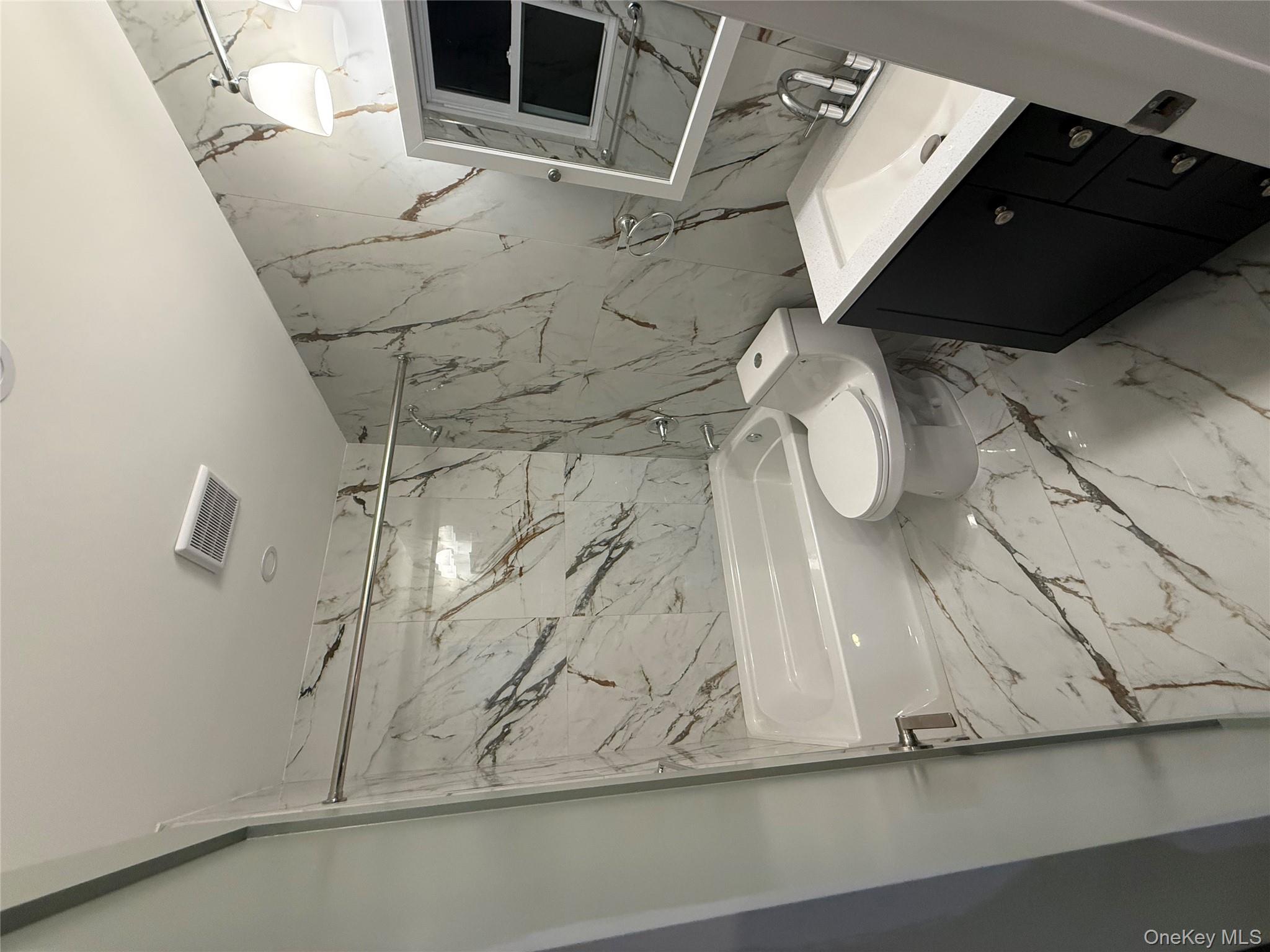 107-13 220th Street Queens, NY 11429 - Photo 5 of 10 a bathroom with a sink toilet and shower