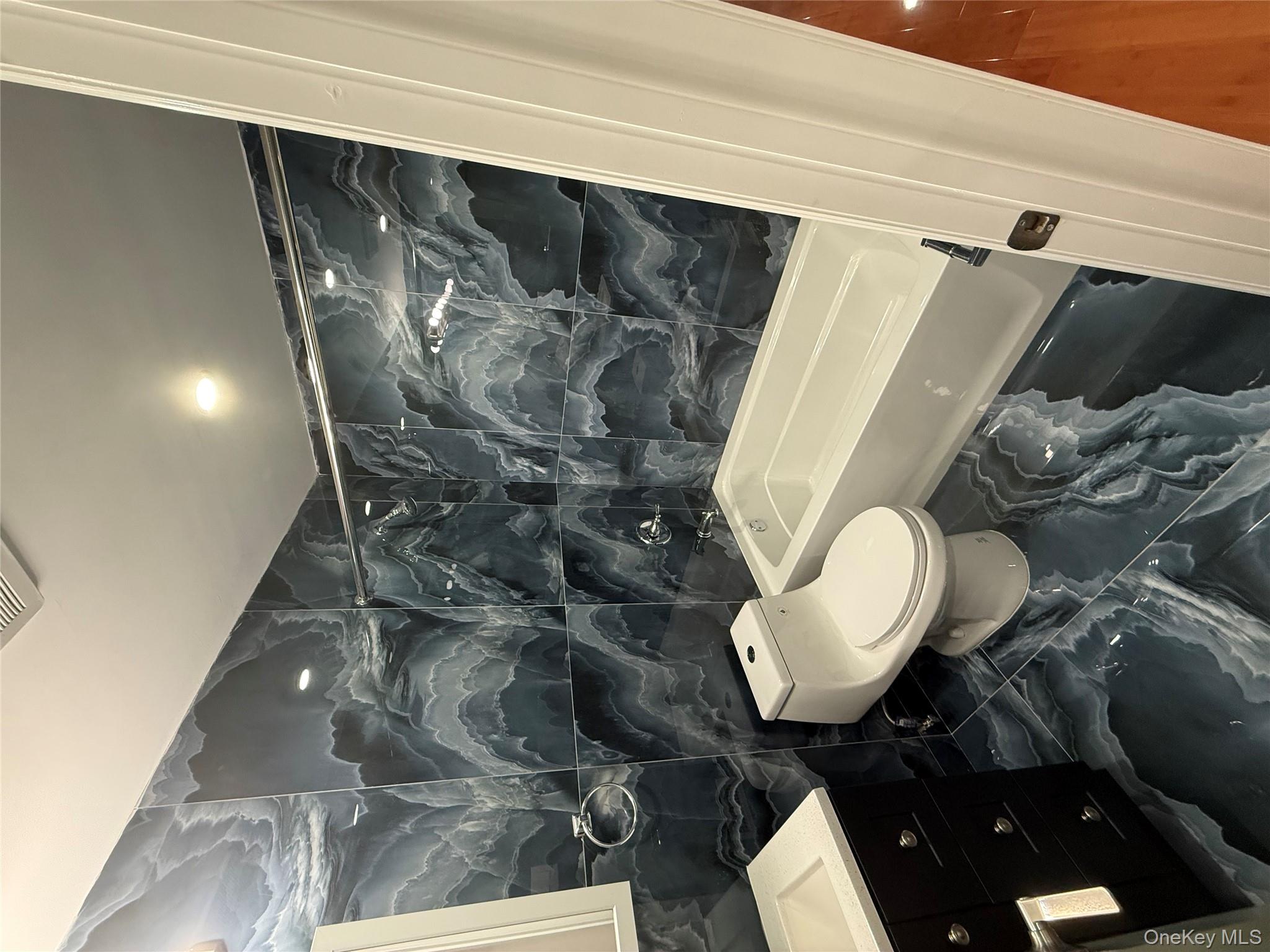 107-13 220th Street Queens, NY 11429 - Photo 8 of 10 a bathroom with a sink toilet and shower