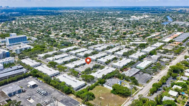 an aerial view of residential houses with city view