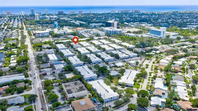 an aerial view of a house with a yard and potted plants