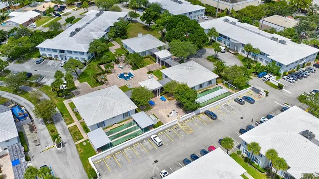 an aerial view of residential house with parking