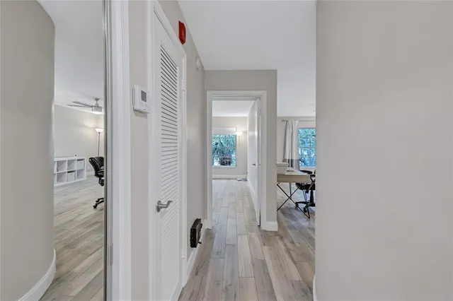 a kitchen with white cabinets and appliances