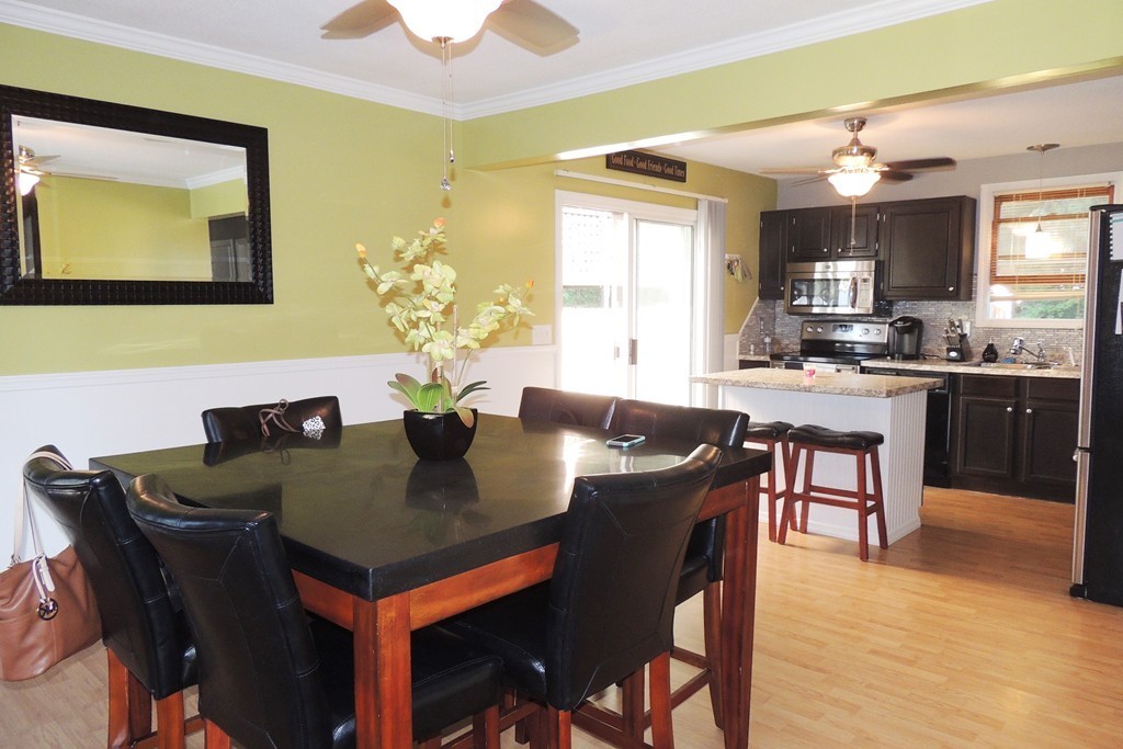 49 Wing Street Springfield, MA 01151 - Photo 4 of 19 a view of a dining room with furniture and wooden floor