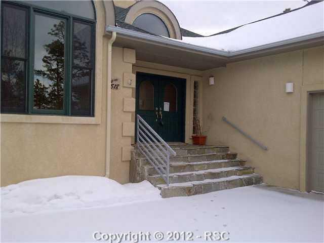 18518 Wetherill Road Monument, CO 80132 - Photo 16 of 16 Gracious covered entry with attractive flagstone stairs