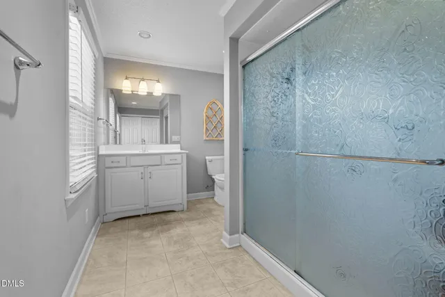 a view of a room with lots of wooden furniture and entryway