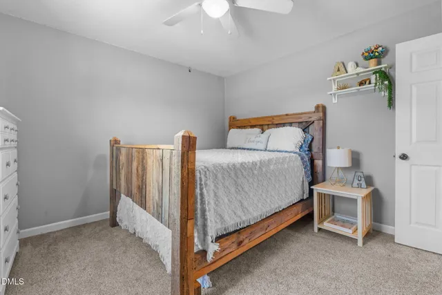 a children room with toys and a fan